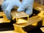 Gold wavers as traders weigh higher bond yields, oil at US$100